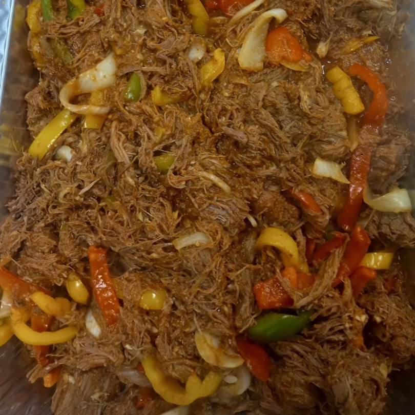 Close-up of Ropa Vieja, shredded beef with colorful bell peppers and onions, from Havana House Cuban Eatery.